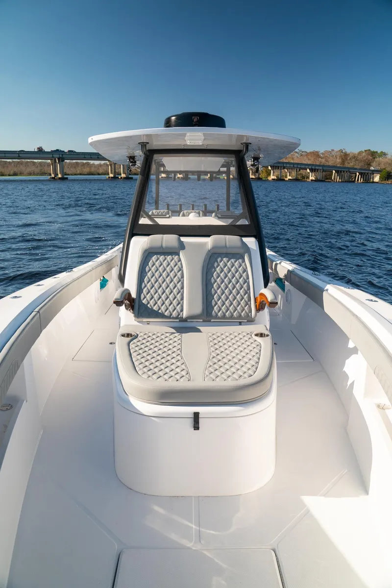 Slide: The Image of 2026 Front Runner 36 Center Console boat on water, featuring sleek design and comfortable seating. - 9