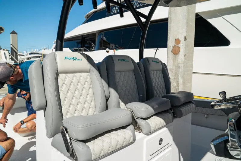 Slide: The Image of Luxury seating on 2026 Front Runner 37 Catamaran, featuring diamond-stitched upholstery. - 14