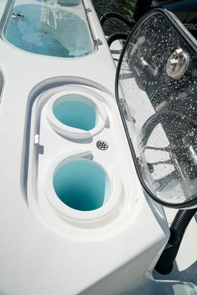 Slide: The Image of 2026 Front Runner 37 Catamaran cup holders and control panel detail. - 15