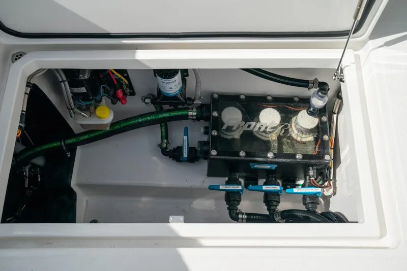 Slide: The Image of 2026 Front Runner 37 Catamaran engine compartment with visible components and wiring. - 26