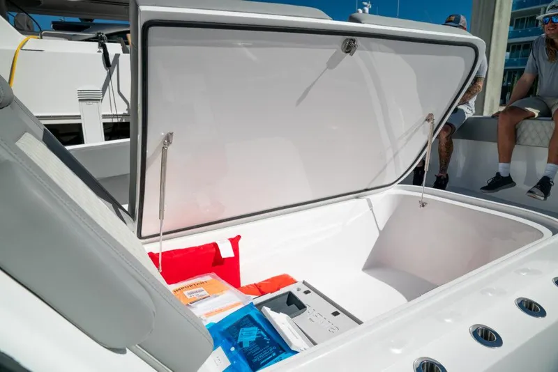 Slide: The Image of Open storage compartment on 2026 Front Runner 37 Catamaran, showcasing spacious interior and accessories. - 8