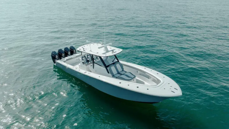 Slide: The Image of 2026 Front Runner 39 Center Console boat on open water, featuring multiple outboard engines. - 11