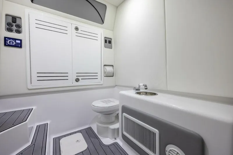Slide: The Image of 2026 Front Runner 39 Center Console boat bathroom interior with modern fixtures and storage. - 15