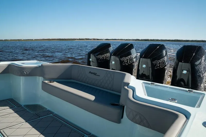 Slide: The Image of 2026 Front Runner 39 Center Console boat with powerful engines on a calm water backdrop. - 27