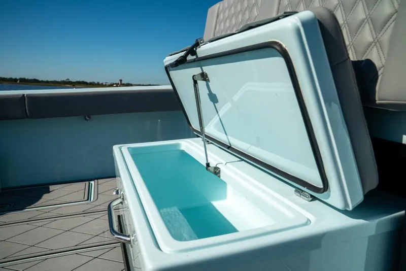 Slide: The Image of Open storage compartment on 2026 Front Runner 39 Center Console boat. - 31