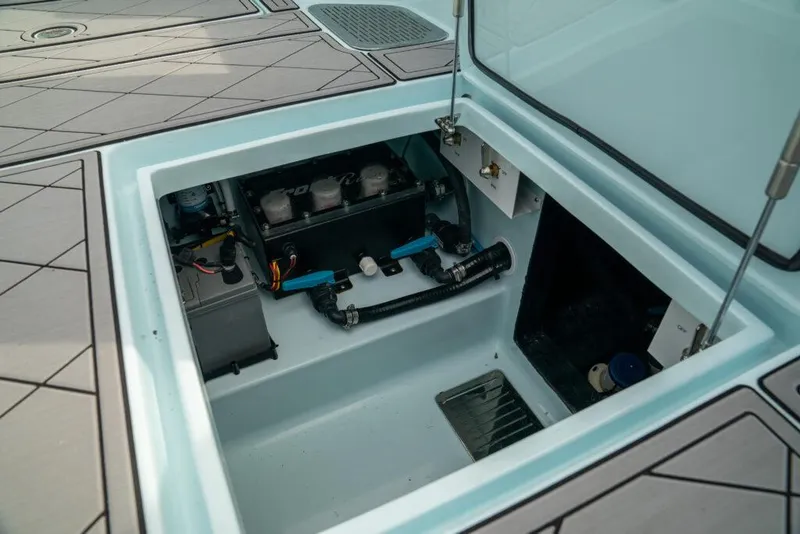 Slide: The Image of 2026 Front Runner 39 Center Console boat's open storage compartment with visible equipment. - 33