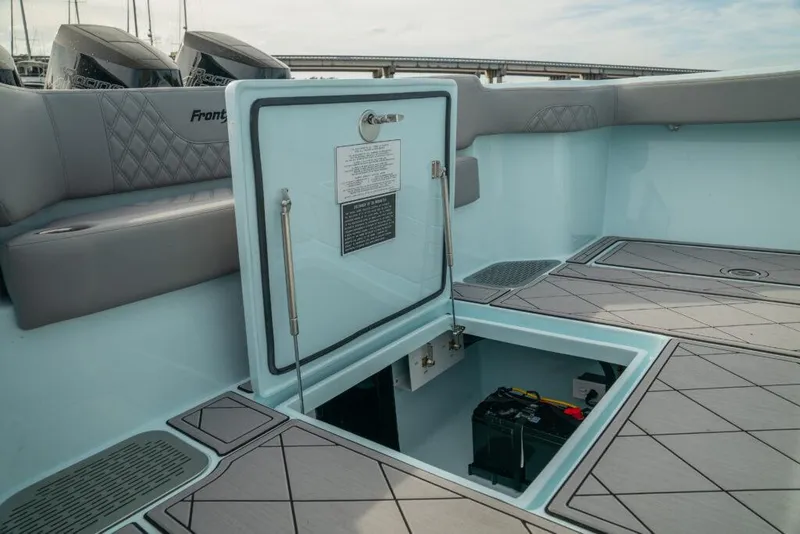 Slide: The Image of 2026 Front Runner 39 Center Console boat with open storage compartment on deck. - 35