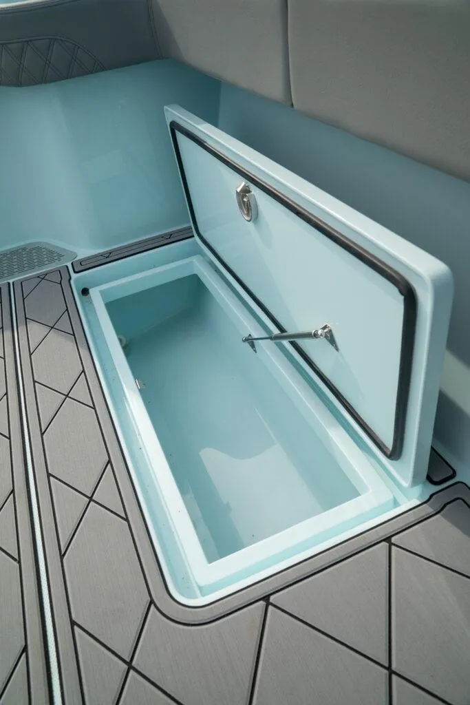 Slide: The Image of 2026 Front Runner 39 Center Console storage compartment with open lid, showcasing interior design. - 38