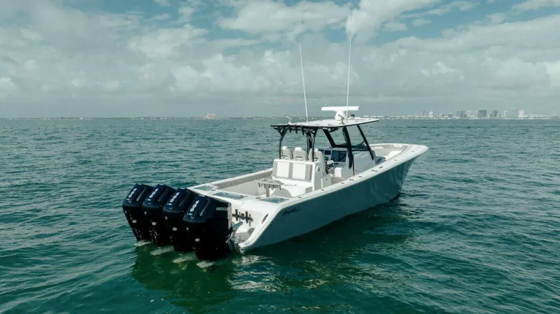 Slide: The Image of 2026 Front Runner 39 Center Console boat on open water, featuring multiple outboard engines. - 4