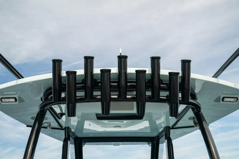 Slide: The Image of 2026 Front Runner 39 Center Console boat with rod holders against a blue sky. - 41