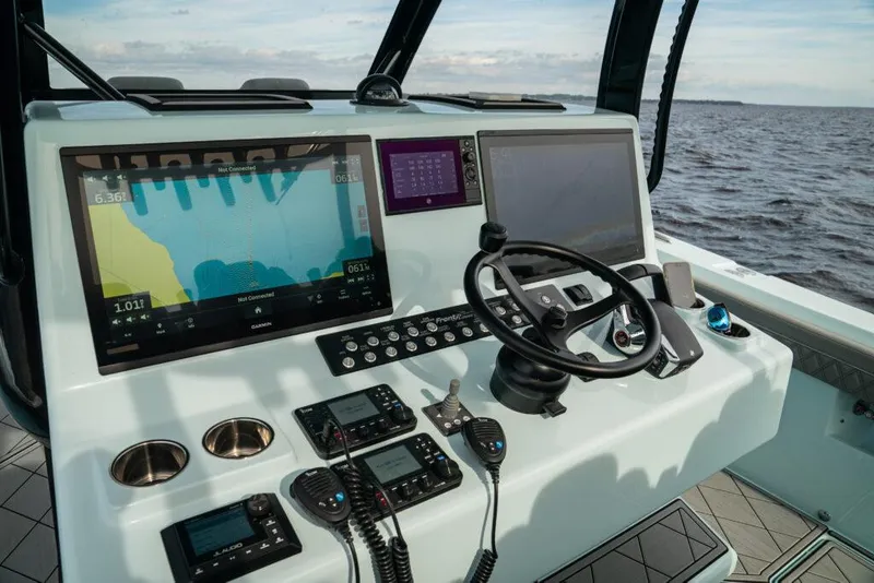 Slide: The Image of 2026 Front Runner 39 Center Console boat dashboard with advanced navigation systems. - 42