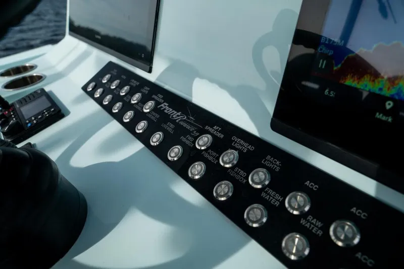 Slide: The Image of Control panel of 2026 Front Runner 39 Center Console boat with digital displays. - 44