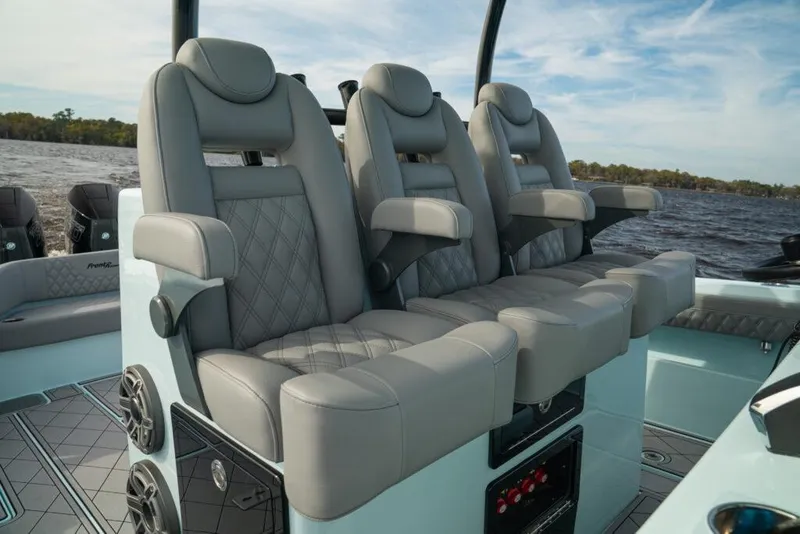Slide: The Image of Luxurious seating on 2026 Front Runner 39 Center Console boat, featuring plush gray upholstery. - 46