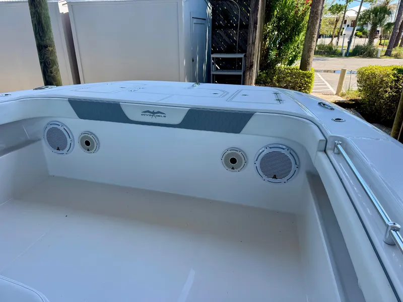 Slide: The Image of 2022 Invincible 46 Catamaran interior with speakers and sleek design. - 18