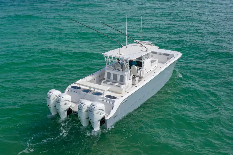 Slide: The Image of Invincible 46 Catamaran 2022 cruising on clear blue ocean waters. - 38