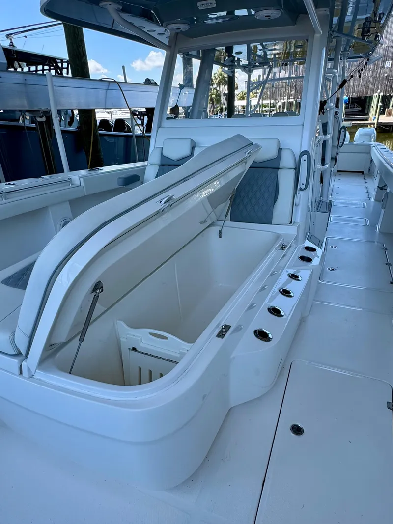 Slide: The Image of 2022 Invincible 46 Catamaran with open storage compartment on deck. - 8