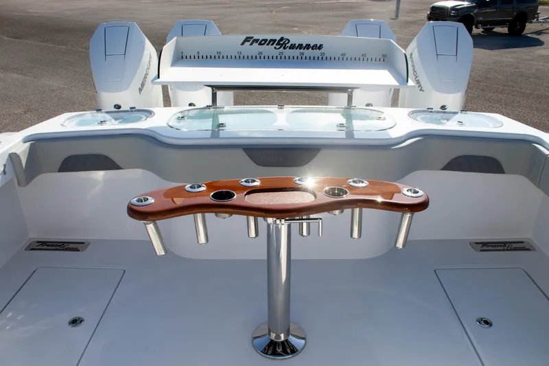 Slide: The Image of 2026 Front Runner 43 Catamaran cockpit with fishing rod holders and dual engines. - 12