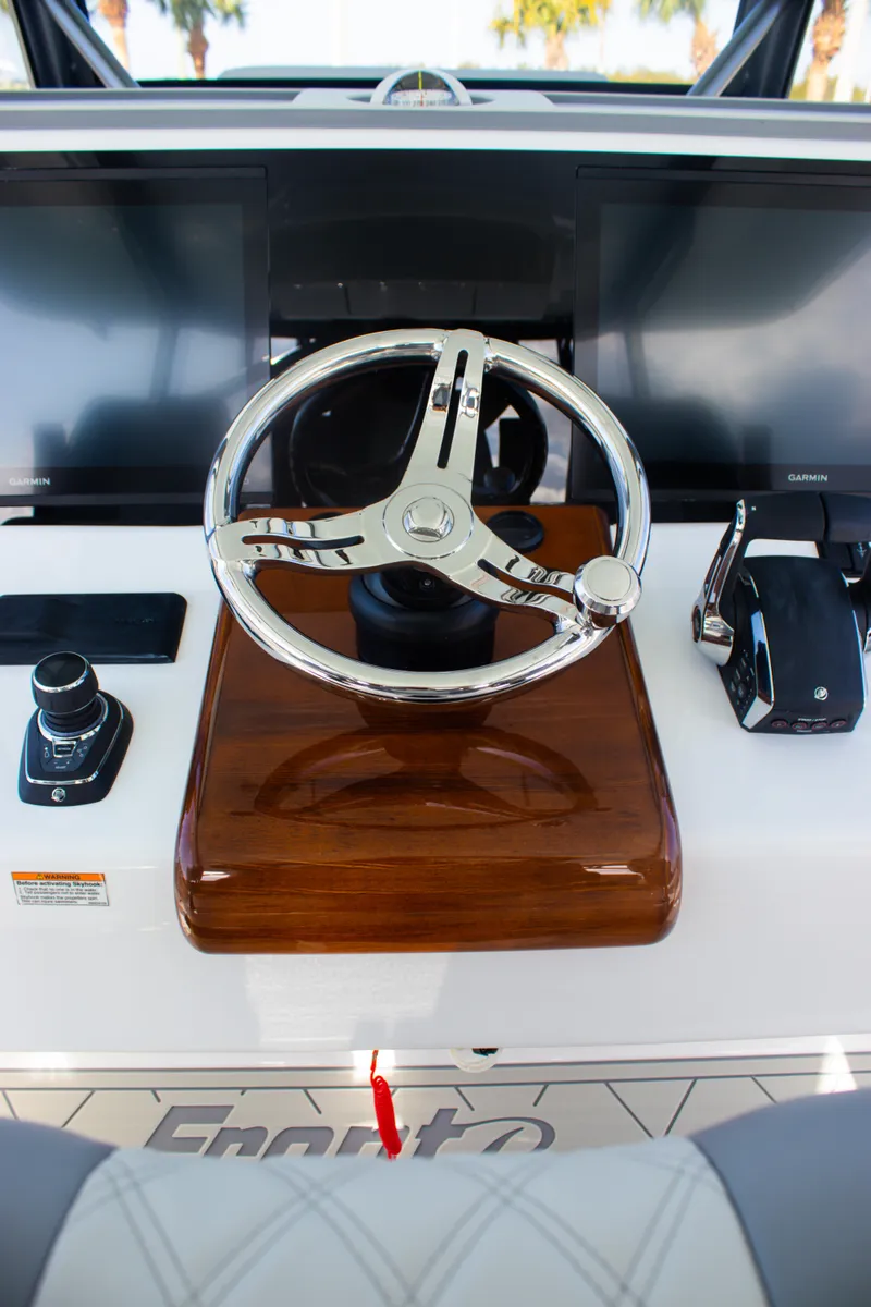 Slide: The Image of Steering console of 2026 Front Runner 43 Catamaran with modern controls and displays. - 24