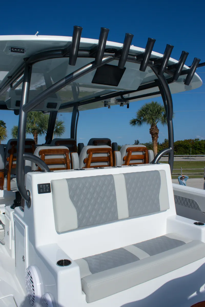 Slide: The Image of 2026 Front Runner 43 Catamaran with seating and rod holders, under clear blue sky. - 25