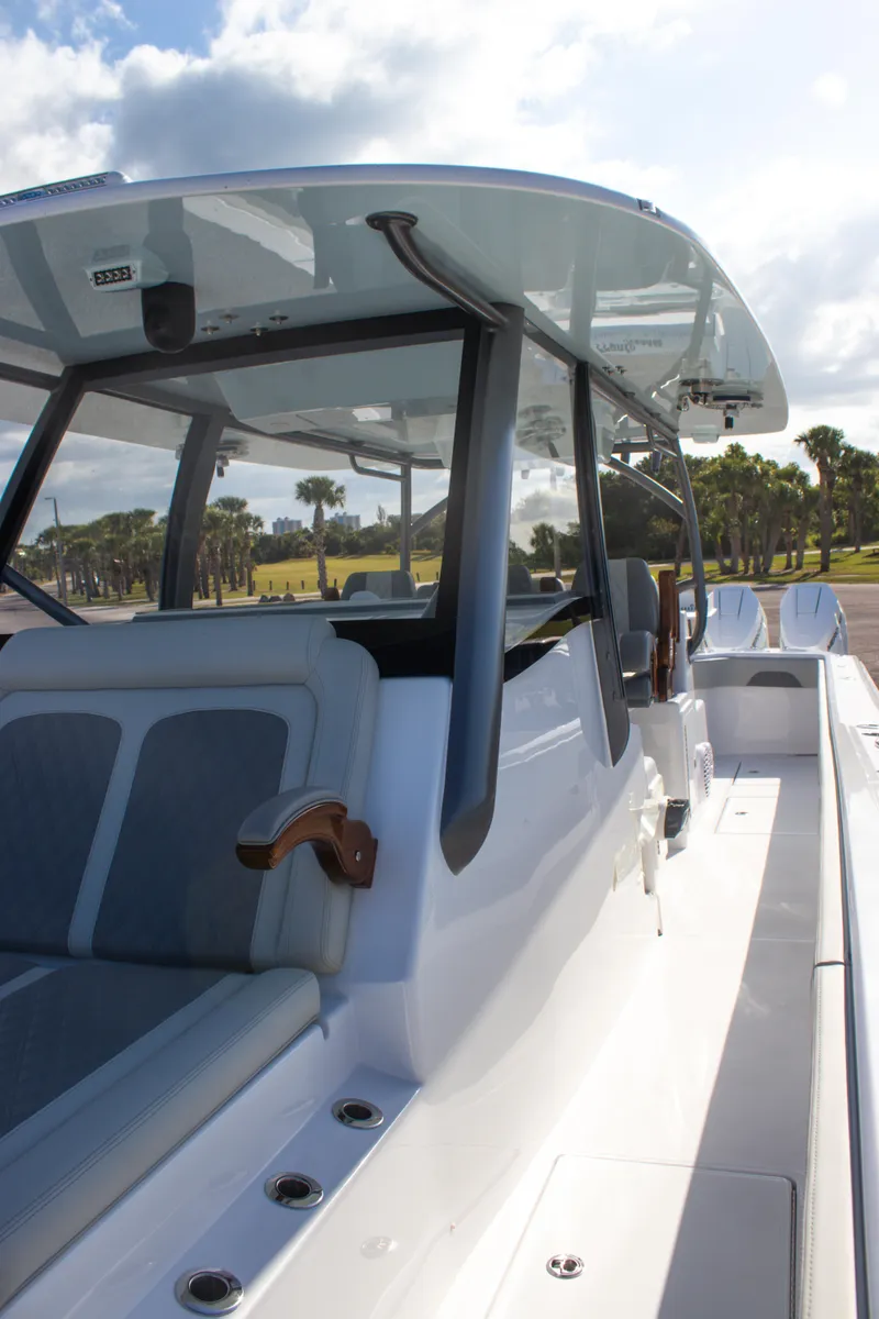 Slide: The Image of 2026 Front Runner 43 Catamaran with sleek design and spacious seating under a clear sky. - 30