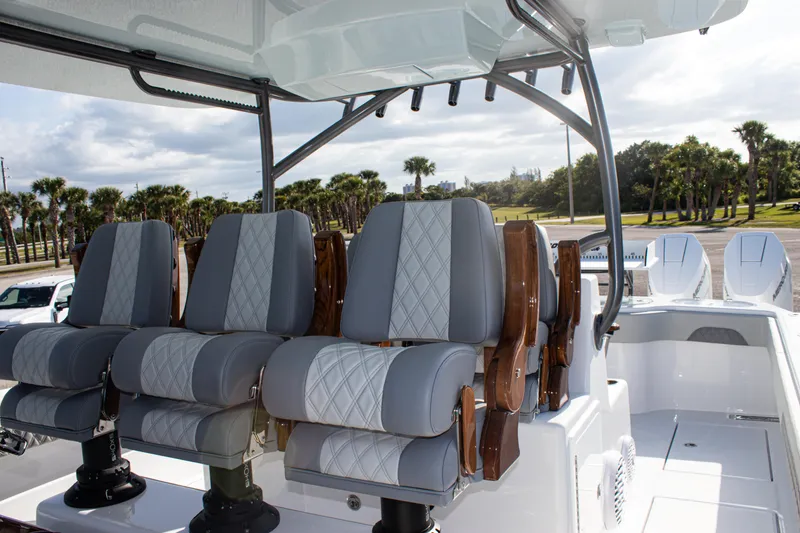 Slide: The Image of Luxury seating on 2026 Front Runner 43 Catamaran, featuring plush gray and white upholstery. - 31