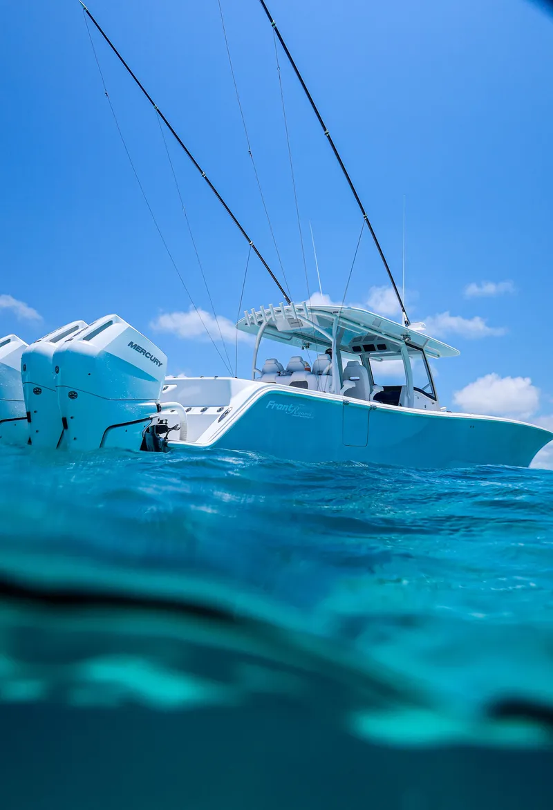 Slide: The Image of 2026 Front Runner 43 Catamaran on clear blue water under a sunny sky. - 5