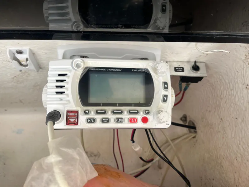 Slide: The Image of VHF marine radio on 1998 Blue Fin 25 Center Console boat dashboard. - 9