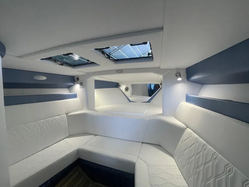 Slide: The Image of Luxurious interior of 2025 Nor-Tech 420 Monte Carlo boat with elegant seating and skylights. - 5