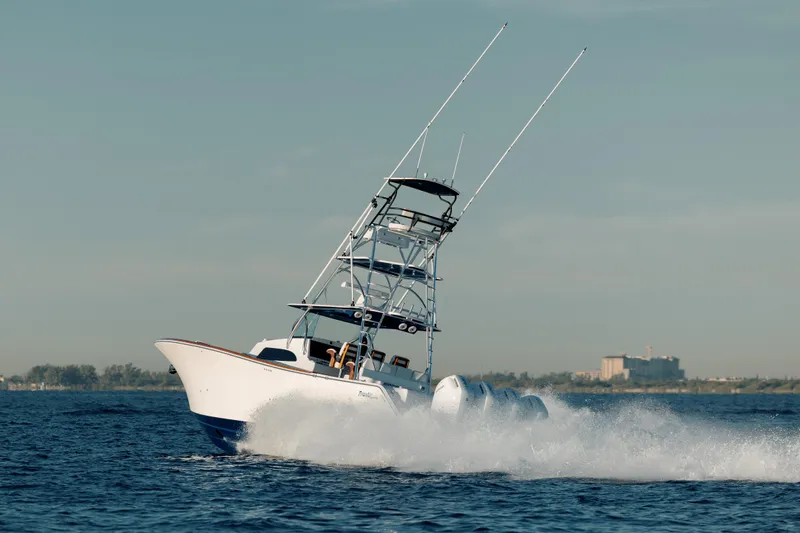 Slide: The Image of 2026 Front Runner 47 Center Console boat cruising on open water, creating a dynamic splash. - 13