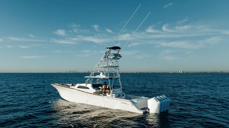 Slide: The Image of 2026 Front Runner 47 Center Console boat on open sea under clear sky. - 17