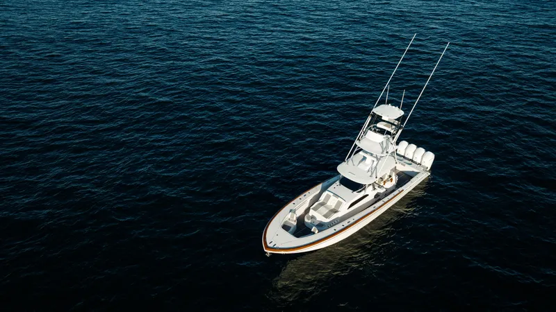 Slide: The Image of 2026 Front Runner 47 Center Console boat on open water, aerial view. - 19