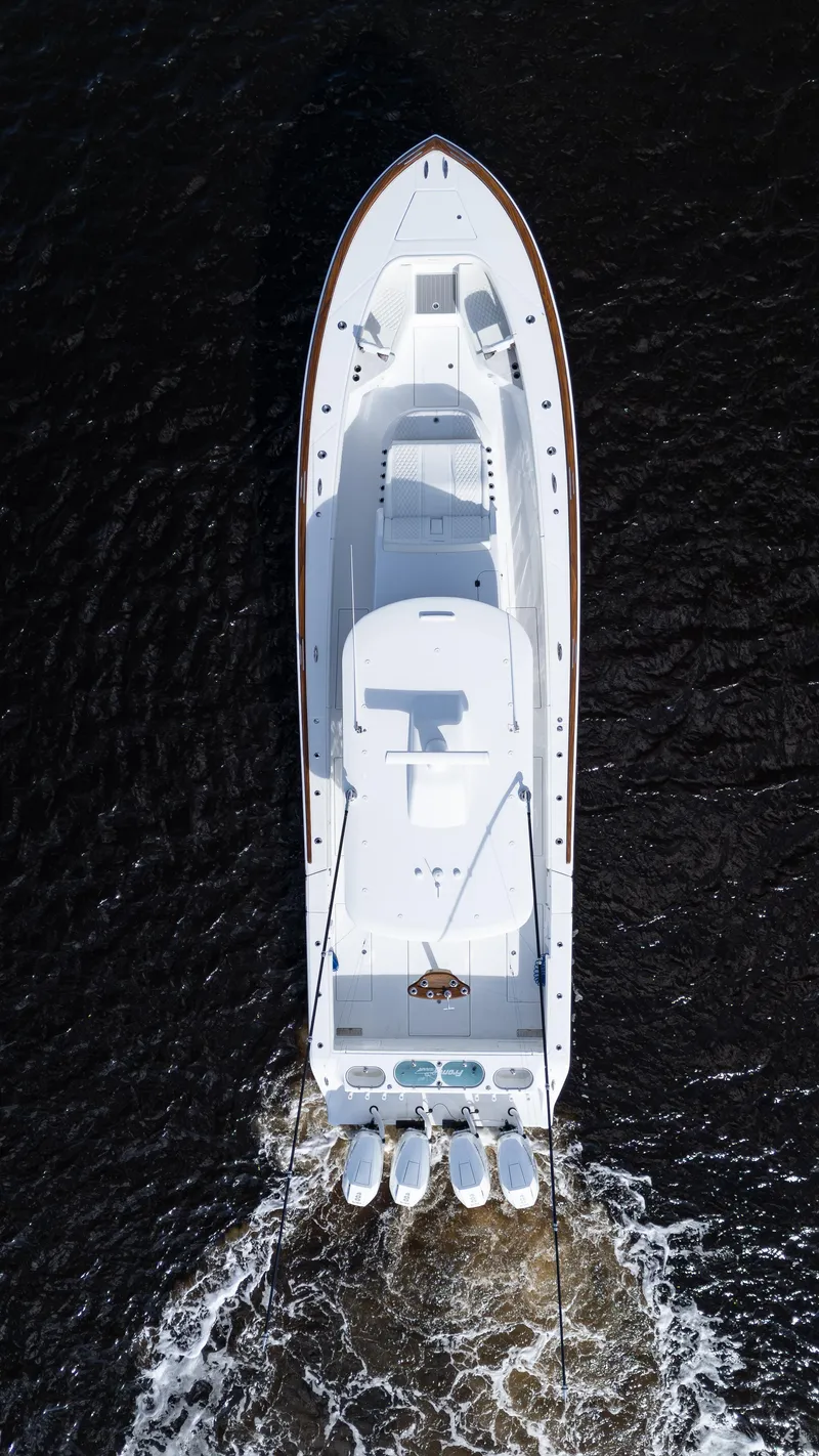 Slide: The Image of Aerial view of 2026 Front Runner 47 Center Console boat cruising on water. - 24