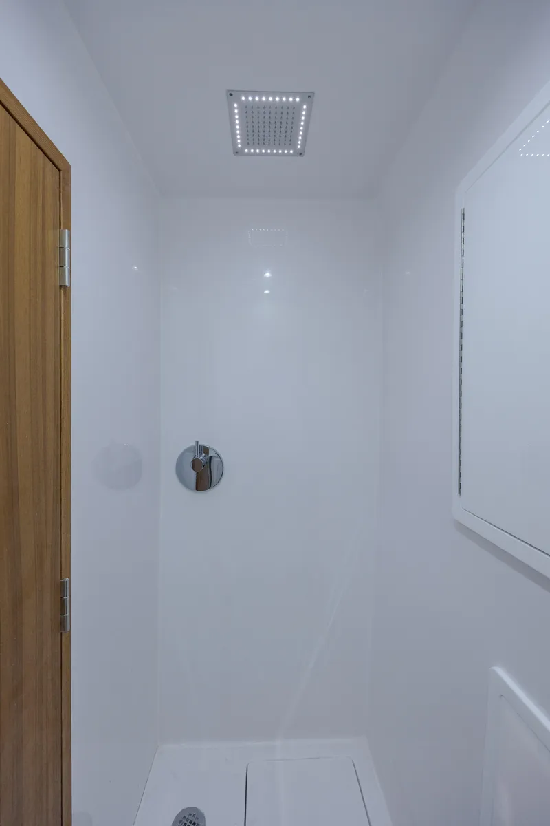 Slide: The Image of Shower area in 2026 Front Runner 47 Center Console boat, featuring modern fixtures. - 32