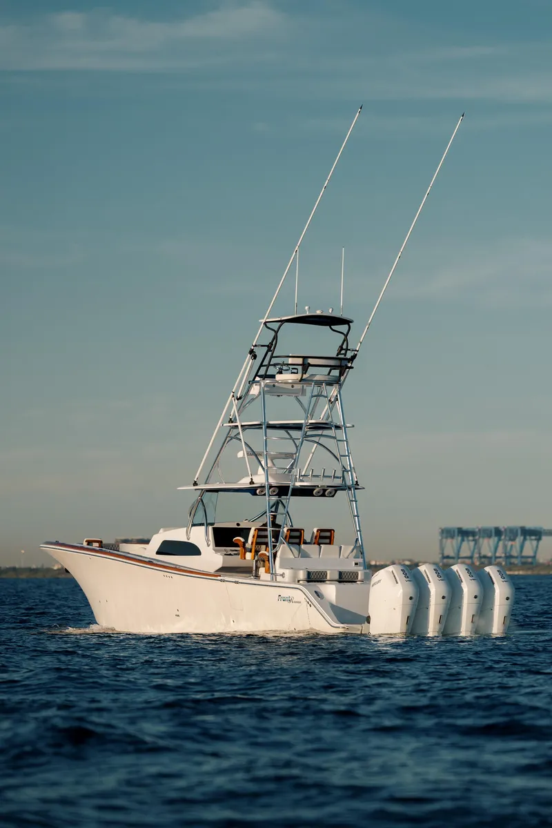 Slide: The Image of 2026 Front Runner 47 Center Console boat with multiple engines on open water. - 4