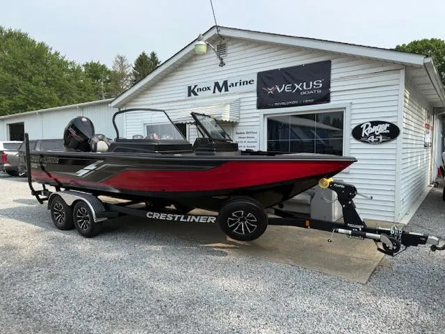 Slide: The Image of 2025 Crestliner 2050 Fish Hawk boat on trailer outside Knox Marine building. - 2