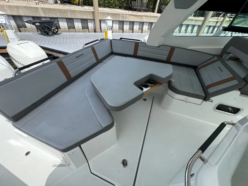 Slide: The Image of 2022 Beneteau Gran Turismo 32 interior with sleek gray seating and modern design. - 23