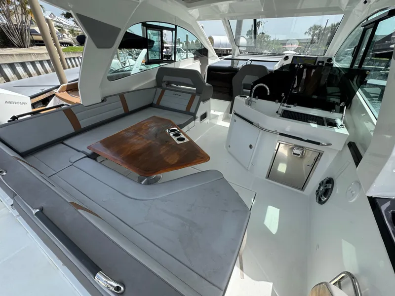 Slide: The Image of Interior of 2022 Beneteau Gran Turismo 32 yacht with modern seating and sleek design. - 25