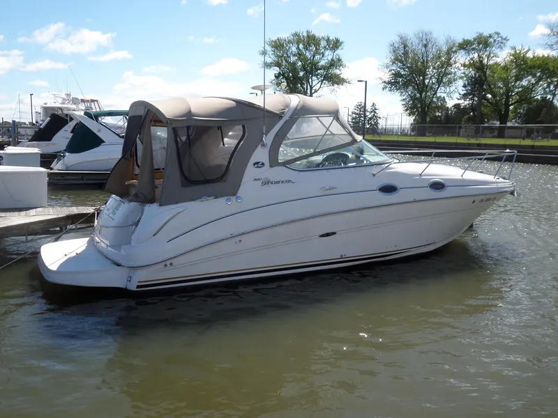 The Image of 2003 Sea Ray 280 Sundancer boat docked in a marina. - 1