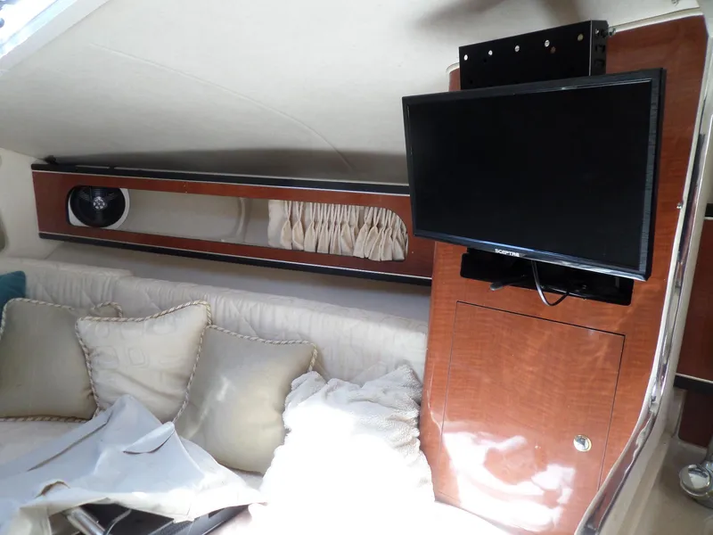 Slide: The Image of Interior of 2003 Sea Ray 280 Sundancer with TV and seating area. - 23