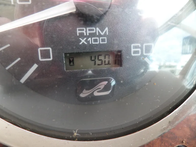 Slide: The Image of Close-up of 2003 Sea Ray 280 Sundancer RPM gauge showing 450.1 hours. - 39