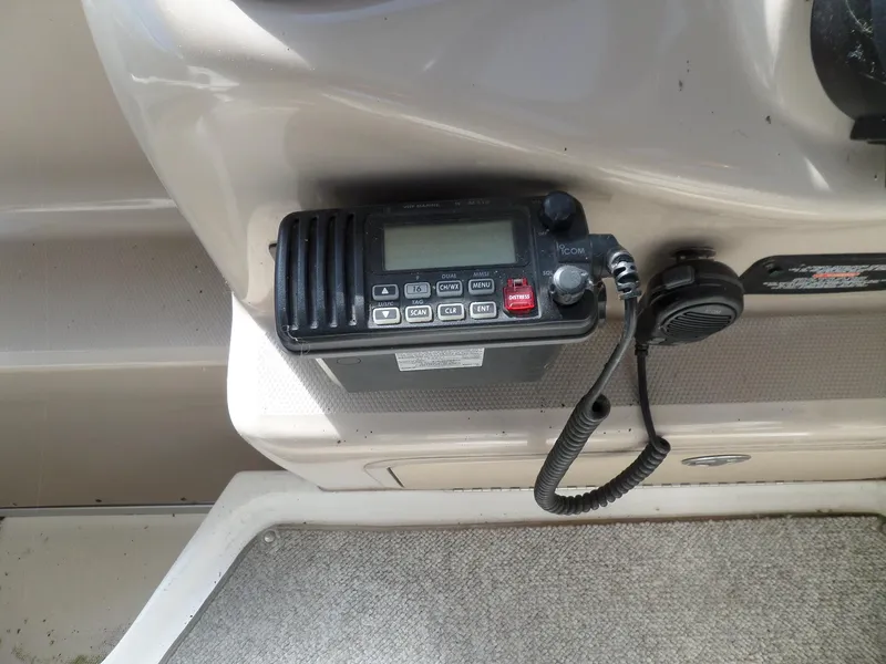 Slide: The Image of VHF radio installed on a 2003 Sea Ray 280 Sundancer boat dashboard. - 8