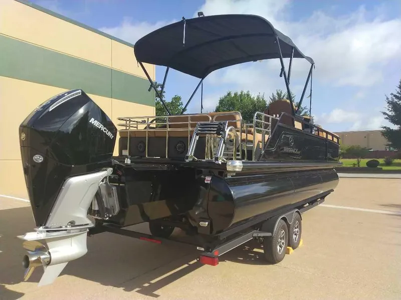 Slide: The Image of 2025 Regency 250 LE3 Sport pontoon boat with Mercury engine on trailer. - 5