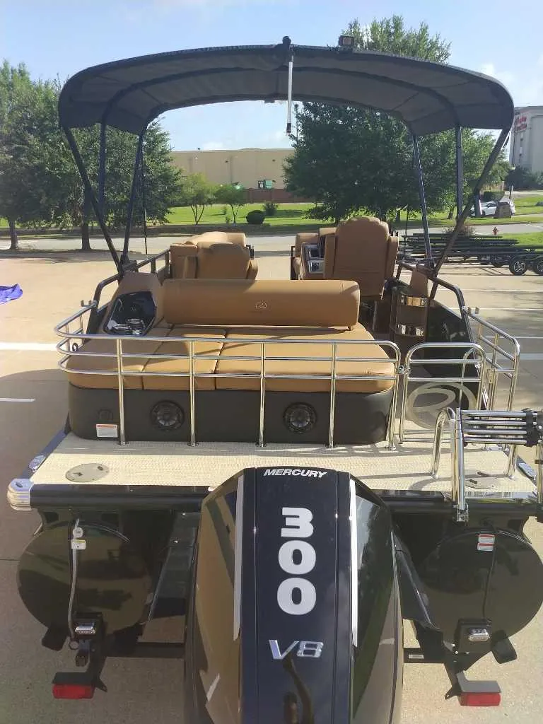 Slide: The Image of 2025 Regency 250 LE3 Sport pontoon boat with Mercury 300 V8 engine, rear view. - 7