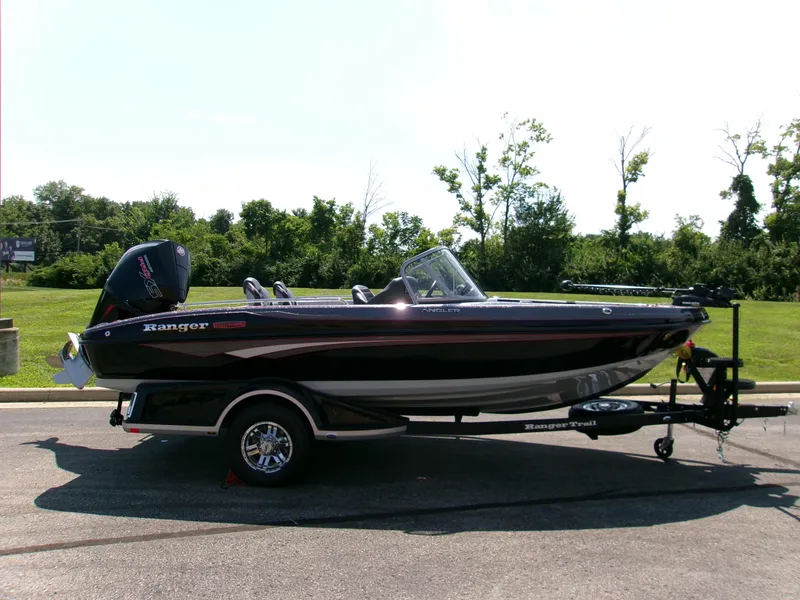 The Image of 2025 Ranger 1880MS boat on trailer, parked outdoors, side view. - 0