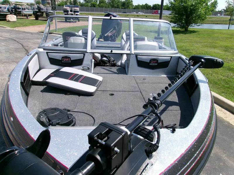 Slide: The Image of 2025 Ranger 1880MS boat with spacious deck and modern seating, parked outdoors. - 3