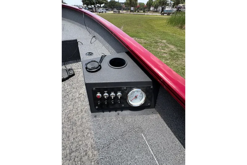 Slide: The Image of 2025 Tracker Super Guide V-16 T boat dashboard with controls and gauge. - 45