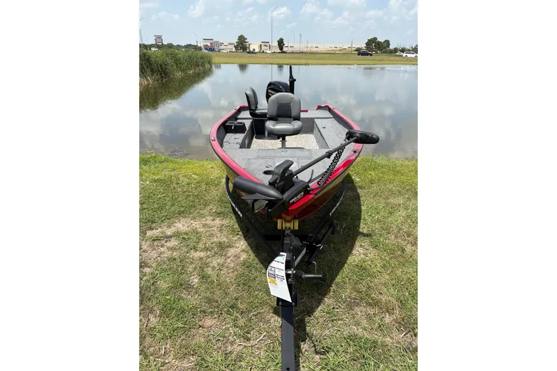 Slide: The Image of 2025 Tracker Super Guide V-16 T boat by a serene lake, ready for fishing adventures. - 47