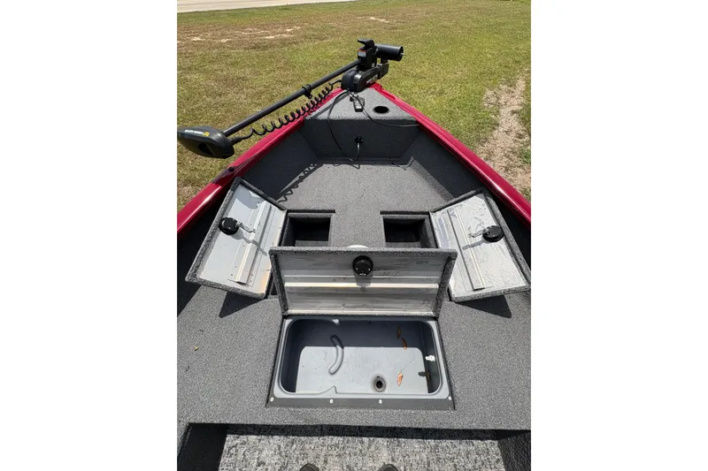 Slide: The Image of 2025 Tracker Super Guide V-16 T boat interior with storage compartments and trolling motor. - 41