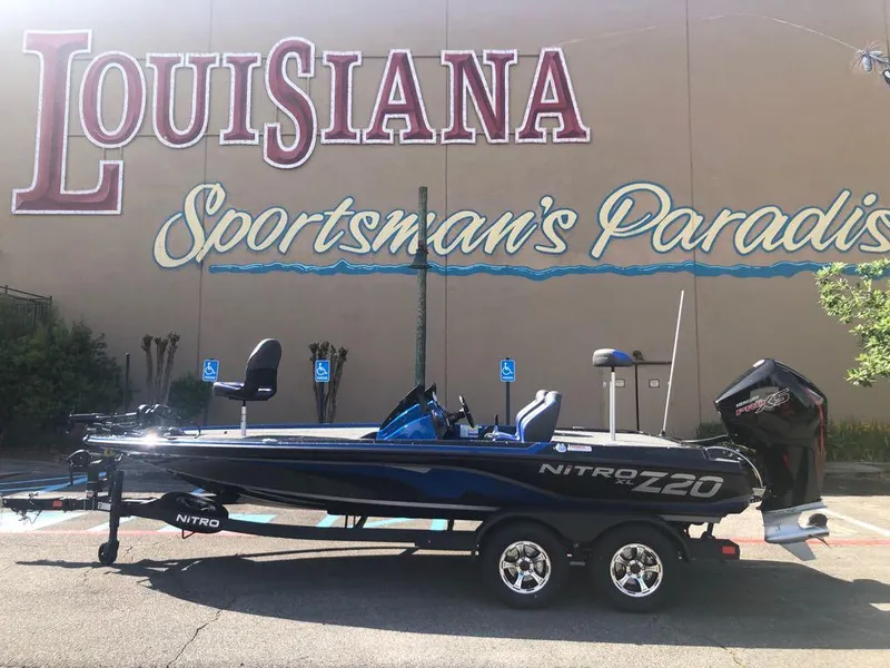 The Image of 2025 Nitro Z20 XL boat parked in front of "Louisiana Sportsman's Paradise" sign. - 0