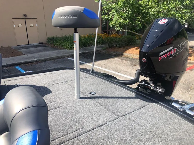 Slide: The Image of 2025 Nitro Z20 XL boat with Mercury Pro XS engine, parked outdoors. - 13